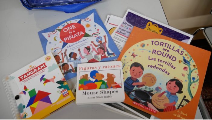 colorful books in Spanish on a table